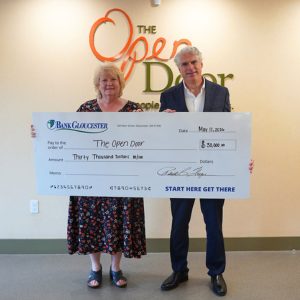 BankGloucester President presenting $30,000 annual donation check to The Open Door President.
