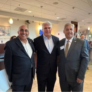 BankGloucester President with two gentlemen all in suits attending the 2025 Banking for the Community event.