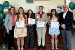 2026 Scholarship winners holding their scholarship signs posing for a picture with BankGloucester President and Vice President.