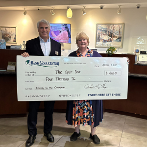 2025 Banking for the Community second place winners The Open Door. BankGloucester president presenting a check to Julie LaFontaine